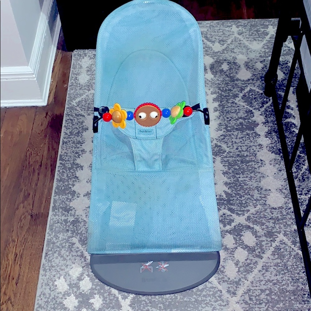 Babybjorn bouncer with Googly Eyes toy.
